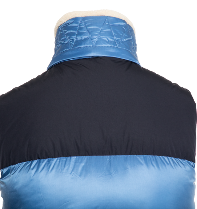 Image 3 of 3 - BLUE - MONCLER Oust Down Gilet featuring recycled micro ripstop lining, down-filled, detachable and adjustable hood with teddy lining, zip closure, zipped pockets, patch pocket on the chest and elastic armholes and hem. 100% polyamide. Collar: 79% polyester, 21% wool. Yoke: 100% polyester. Padding: 90% down, 10% feather. 