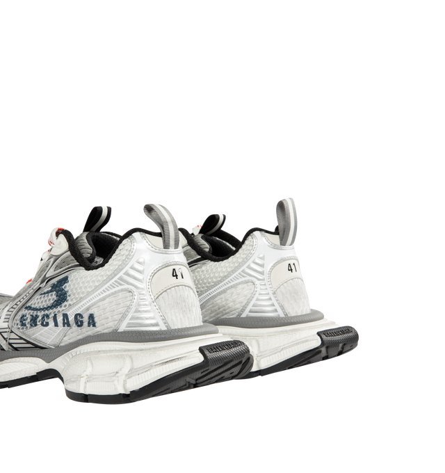 Image 3 of 5 - WHITE - BALENCIAGA 3XL Split Logo Sneaker featuring worn-out effect, split artwork printed on the exterior, Balenciaga logo at the edge of the toe and at back, printed size on the upper and at the back of the heel, 3XL branding printed on the tongue and back and tongue pull-on tab with reflective detail. Polyurethane, polyester. Sole: rubber, EVA. Insole: foam.