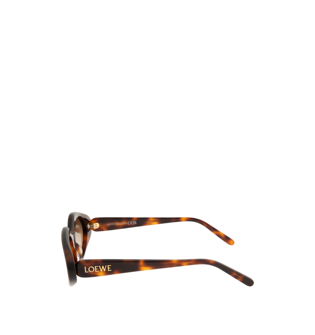 Image 2 of 3 - BROWN - LOEWE Triangle Slim Sunglasses featuring triangle-shaped sunglasses in a slim acetate construction, international fit, UVA/UVB protection and gold-finish metal LOEWE. Acetate. Made in Italy.