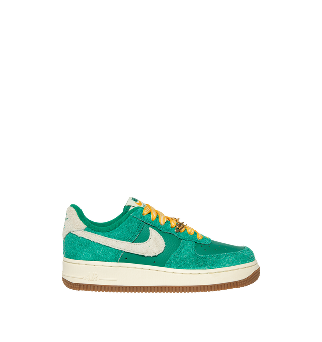 Image 1 of 5 - GREEN - Nike Women's Air Force 1 07' Game Day Sneakers feature a genuine and synthetic leather upper with a perforated toe box for breathable comfort and a timeless look. These iconic lifestyle sneakers combine lightweight Nike Air cushioning, a padded collar, and a durable rubber outsole with classic pivot-circle traction for everyday wear. Clip-on charms add a customizable finishing touch. Main Material: Genuine Leather and Synthetic Leather. Midsole: Foam with Nike Air Unit. Sole: Rubber.