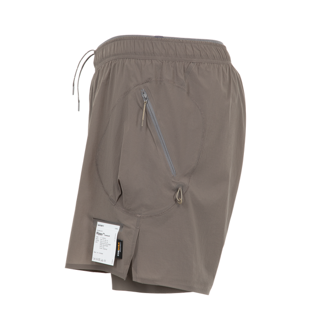 Image 3 of 3 - GREY - Satisfy Men's Rippy Cordura 5" Trail Shorts are crafted from durable Rippy Cordura fabric that features a 5-inch trail-running silhouette engineered for extended mileage and enhanced abrasion resistance. Designed with a TechSilk Drift liner for airflow, moisture management, and natural stretch. Functional details include two zippered side cargo pockets, a sweat-resistant hidden phone pocket, a double waistband with internal drawcords, a mini S-Carabiner, and stealth-reflective logo de