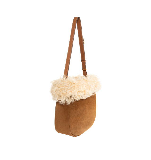 Image 2 of 3 - BROWN - SAINT LAURENT Roady Shoulder Bag featuring suede exterior and lining with dyed shearling trim, magnetic snap closure at the top, one main compartment with one zip pocket and two interior slip pockets. 13" W x 11.8" H x 3.9" D. Made in Italy.