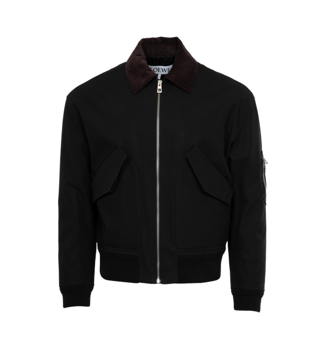 Image 1 of 4 - BLACK - LOEWE Bomber Jacket featuring contrast corduroy collar, rib knit cuffs and hem, zip front fastening, double patch pockets with buttoned flap, zipped utility pocket on the sleeve, inside welt pocket, quilted lining and LOEWE Anagram embossed leather patch placed at the back. 100% cotton. Made in Italy. 