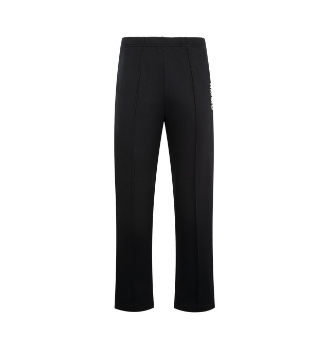 Image 1 of 4 - BLACK - HUMAN MADE Track Pants featuring straight cut with sharp front pleats, stripes down side seams, elasticated waist, two front pockets, one back pocket, vented hem and text graphic on leg. 100% polyester.