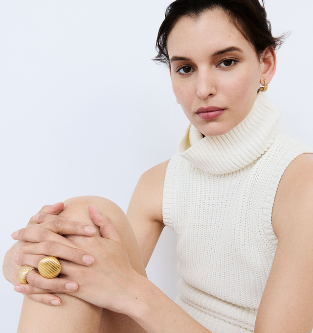 Image 3 of 3 - GOLD - Pamela Zamore Isla dome ring finely crafted in Rhode Island from hand-finished 18k gold. Top diameter measures 26mm. Isla brings form to Pamelas love of working with texture and shape. A gleaming finish of polished ridges and sandblasted channels evoke both the nobility of ancient worlds and the glamour of the 70s. Hirshleifers offers a range of pieces from this collection in-store. For personal consultation and detailed information about jewelry, please contact our dedicated stylist