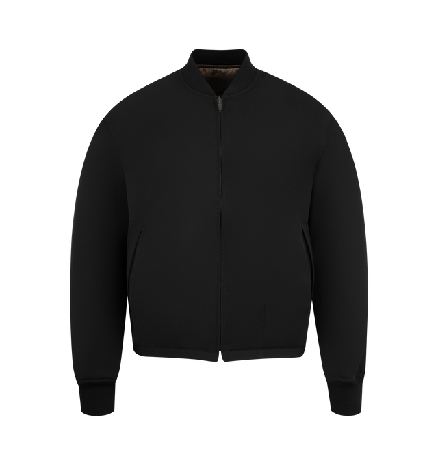Image 1 of 4 - BLACK - THE ROW Fenn Jacket featuring reversible bomber jacket in structured wool gabardine and fluid cupro with ribbed collar and cuffs, side welt pockets and front zipper closure. 100% wool. Fully lined in silk. Made in Italy.