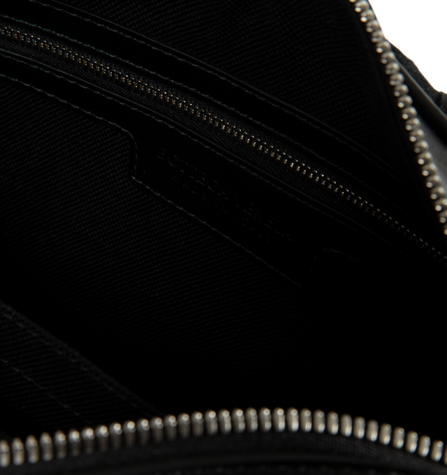 Image 3 of 3 - BLACK - Bottega Veneta Small Intrecciato Crossbody Bag is crafted from Intrecciato leather and suede and features a contrasting striped pattern, a detachable shoulder strap, a metal D-ring, and a zip-top closure. Designed with a canvas-lined interior and a flat pocket for organization, this compact style offers everyday versatility in a signature woven construction. Main Material: Intrecciato Leather and Suede. Lining: Canvas. Hardware: Silver Finish. Dimensions: 24.5 x 15 x 6 cm / 9.6 x 5.9