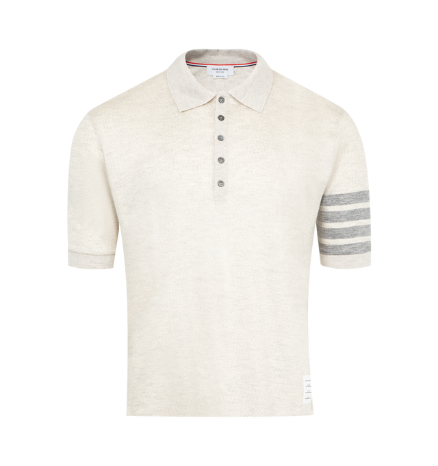 Image 1 of 3 - WHITE - THOM BROWNE Wool Jersey 4-Bar Polo featuring partial front button closure, 4-bar detailing, name tag applique, buttoned side vents with signature striped grosgrain trim and signature striped grosgrain loop tab. 100% virgin wool. Made in Italy.