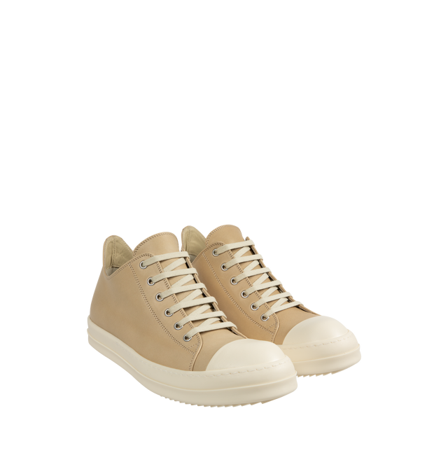 Image 2 of 5 - NEUTRAL - Rick Owens Low Sneaks Sneakers featuring low-top, vegetable-tanned spalla leather, LWG-certified leather, calfskin cap toe, lace-up closure, eyelets at inner side, buffed calfskin lining and treaded rubber sole. Upper: leather. Sole: rubber. Made in Italy.