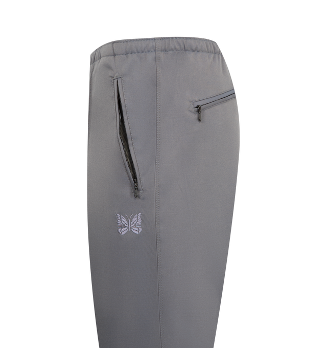 Image 3 of 3 - GREY - NEEDLES Warm Up Pant featuring tapered leg, sporty design with a drawcord waist and zip pockets and embroidered butterfly logo. 86% polyester, 12% wool, 2% polyurethane. Made in Japan.