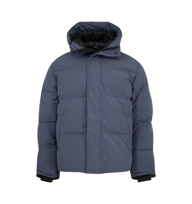 Image 1 of 4 - BLUE - Canada Goose Men's Seymour Parka is crafted from Recycled Organic Arctic Tech and features a quilt-through construction designed for protection in extreme cold-weather conditions. The parka is equipped with an adjustable snorkel hood, a tricot-lined chin guard, and a concealed snap placket over a front zip closure for enhanced coverage. Functional details include interior backpack straps for hands-free carrying, recessed rib-knit cuffs reinforced with CORDURA, two exterior zip pockets,