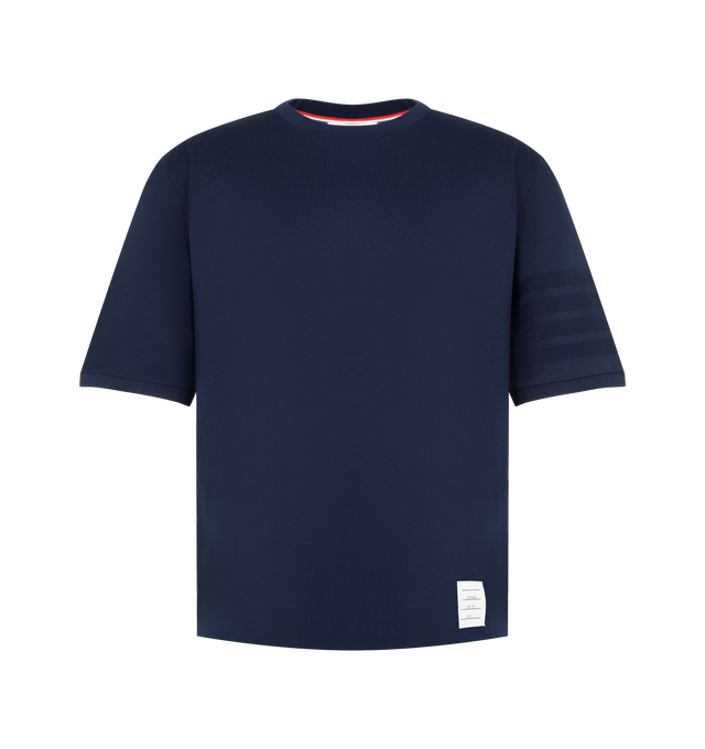 Image 1 of 3 - BLUE - Thom Browne Mens Jersey Ottoman 4-Bar T-Shirt is crafted from cotton jersey and features a rib-knit crew neckline, tonal ottoman-stitch 4-bar detailing at the sleeve, rib-knit cuffs, side vents with signature RWB grosgrain trim, a stepped hem, name tag appliqu, and the signature striped grosgrain loop tab. This designer cotton T-shirt combines a classic crewneck silhouette with iconic Thom Browne detailing for elevated everyday wear. Main Material: 100% Cotton; Combo 1: 87% Cotton, 12%