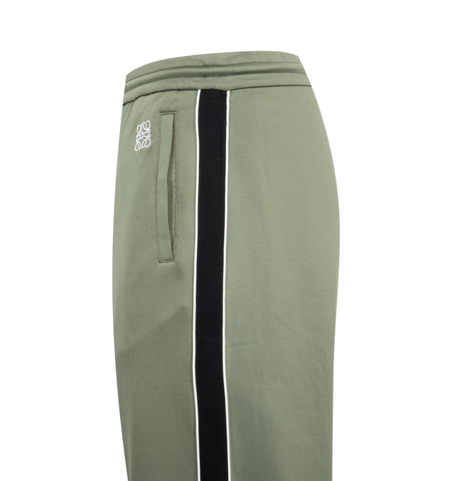 Image 3 of 3 - GREEN - Loewe Men's Tracksuit Trousers in lightweight technical jersey. Relaxed fit, regular length featuring mid waist, straight leg, elasticated waist with drawstring, zipped pockets, zipped rear pocket, herringbone side tape and Anagram embroidery placed at the front. Polyamide/Cotton. Made in Portugal.