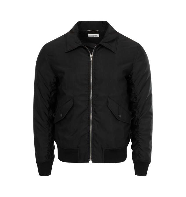Image 1 of 2 - BLACK - SAINT LAURENT Bomber Jacket featuring zip up front, pointed collar, ribbed cuff and hem, two jetted pockets with button flap and nylon lining. 53% acetate, 47% wool. 