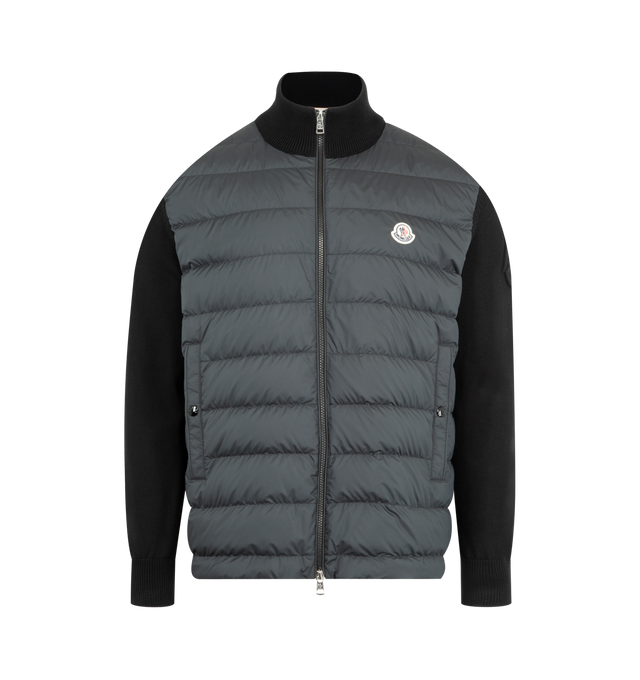 Image 1 of 3 - BLACK - MONCLER Padded Cardigan featuring lightweight micro chic lining, down-filled, stocking stitch, Gauge 7, zipper closure, vertical welt pockets with snap button closure and embossed embroidery. 100% polyester. 100% cotton. Padding: 90% down, 10% feather.