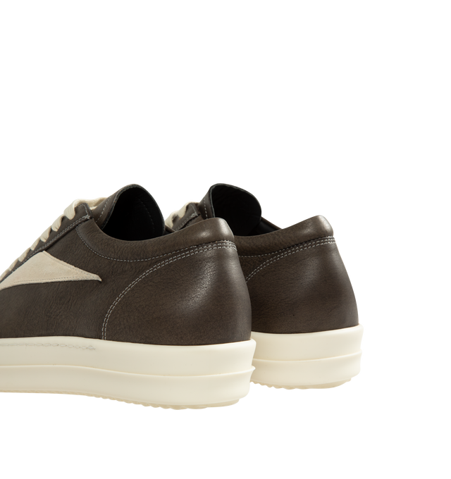 Image 3 of 5 - BLACK - Rick Owens Vintage Sneaks are designed with a low-top design including a lace-up closure, signature shark-tooth soles, and contrast stitching. Upper: 100% Cotton. Lateral Details: 100% Calf Leather. Lining: 100% Cotton. Sole: 100% Thermoplastic Rubber. Sole Height: 3.5 cm / 1.4 in. Closure: Lace-Up. Made in Italy.