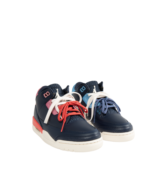 Image 2 of 5 - NAVY - Jordan Women's Air Jordan 3 Retro "Sport Renaissance" Sneakers feature an Obsidian, Track Red, and Chalk upper crafted from leather and synthetic leather. The classic silhouette is finished with a foam midsole, visible Max Air cushioning, and a rubber outsole. Upper: Leather and Synthetic Leather. Midsole: Foam. Sole: Rubber.