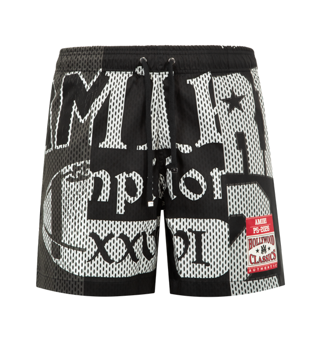 Image 1 of 3 - BLACK - AMIRI Spliced Swim Trunk featuring spliced treatment, side seam pockets, elastic waistband with drawcord and back flap pocket. 100% polyester.