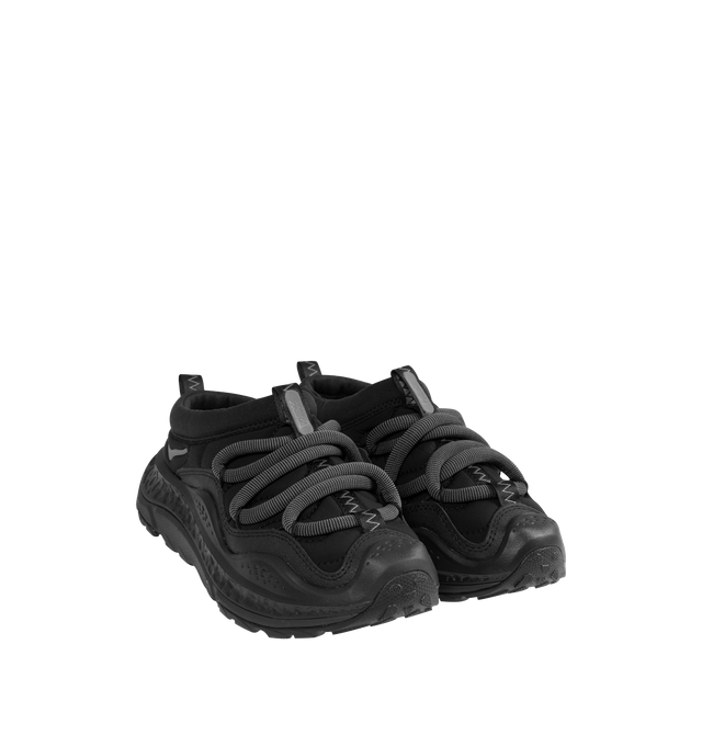 Image 2 of 5 - BLACK - HOKA Ora Primo Sneaker featuring soft knit collar, insulated puff upper, slip-on style, zig-zag stitch detail, round elastic lace system and protective toe bumper. Nylon, textile. Rubber sole.