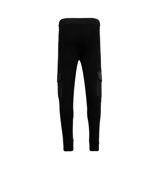 Image 2 of 3 - BLACK - MONCLER Cotton Blend Sweatpants featuring cotton blend fleece, nylon waistband with drawstring fastening, nylon cargo pockets with zipper and snap button closure and rib knit cuffs. 87% cotton, 13% polyamide/nylon. Made in Turkey.