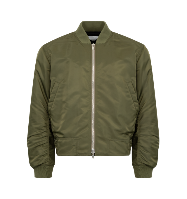 Image 1 of 3 - GREEN - BOTTEGA VENETA Bomber jacket in padded satin nylon with water-repellent finish featuring a detachable shearling collar, Intrecciato leather back patch, fully lined, zipper closure and relaxed fit. 100% polyamide. Made in Italy.