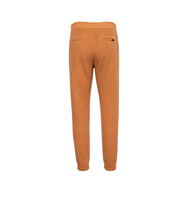 Image 2 of 3 - BROWN - SAINT LAURENT Joggers featuring hidden button closure, two side pockets, elastic waist with drawcord, elasticated hem, two back welt pockets and metal aglets. 100% cotton. Made in Italy. 