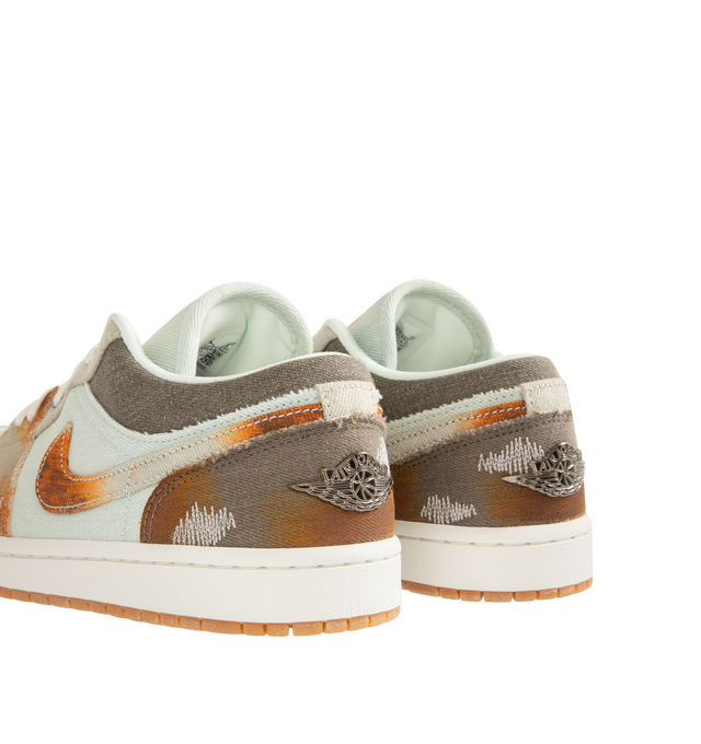 Image 3 of 5 - MULTI - JORDAN Air Jordan 1 Low SE Sneaker featuring fabric panels with frayed edges and distressed details, paint-like splatters, shimmering Wings logos on the heel, metallic Jumpman branding on the tongue, low top and gum outsole.