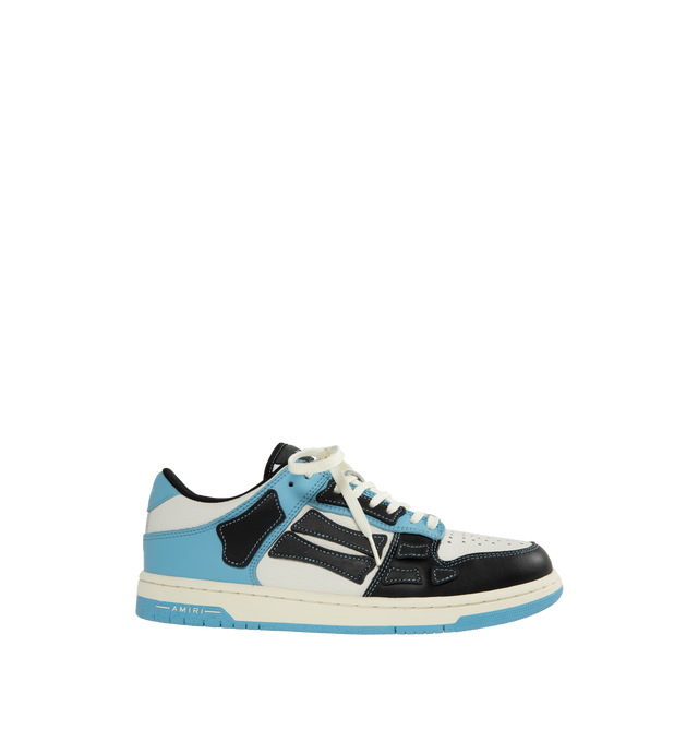 Image 1 of 5 - BLUE - AMIRI Skeltop Low featuring logo at the back, logo on the tongue, logo on the side and closed, round toe. Smooth and pebbled leather upper with rubber sole. 
