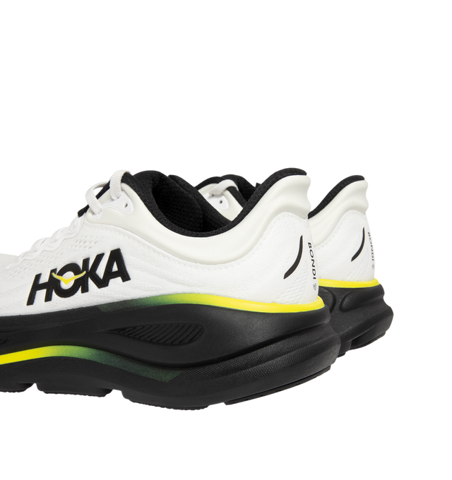 Image 3 of 5 - WHITE - Hoka M Bondi 9 Sneaker featuring engineered mesh upper with rubber sole, lace-up front, foamed EVA midsole and increased stack height for maximum cushioning, zonal breathability, reflective detailing and cushioned tongue and collar.