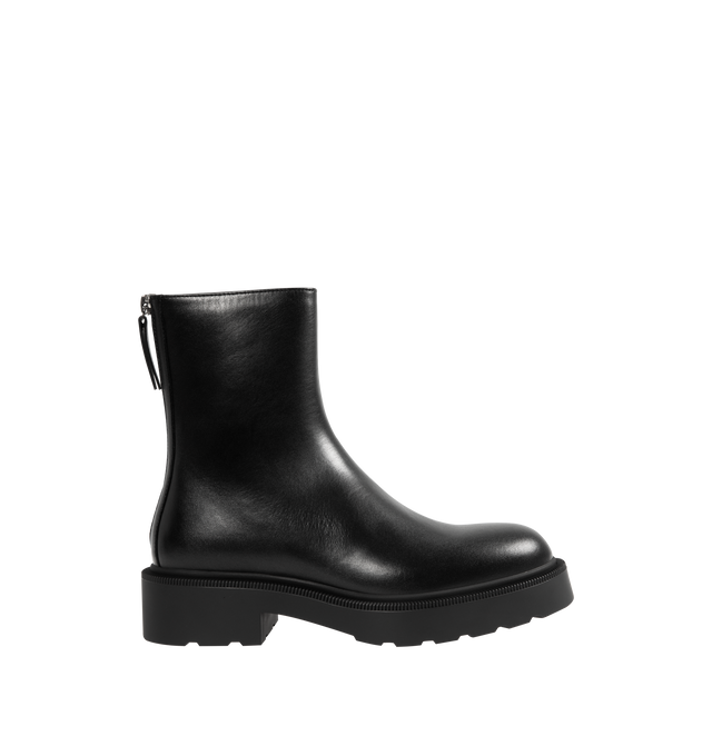 Image 1 of 4 - BLACK - THE ROW Nobilis Fast Boot featuring versatile ankle boot in polished calfskin leather with round toe, back zipper closure and treaded rubber platform sole. 100% calfskin leather. Synthetic sole. Made in Italy.