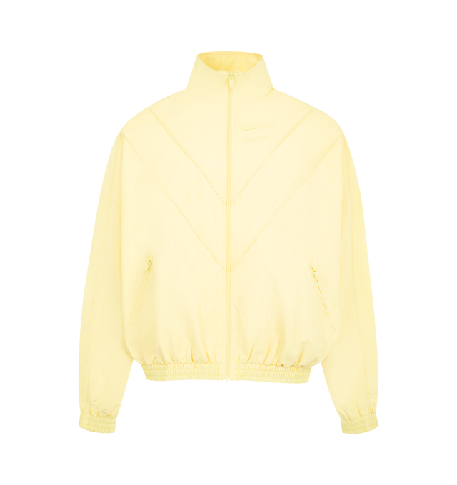Image 1 of 2 - YELLOW - WILLY CHAVARRIA Bad Boy Track Jacket featuring front zipper closure, tonal logo detail at chest, side slant pockets and lightweight ripstop fabric. 100% nylon. Lining: 100% polyester.