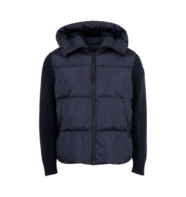 Image 1 of 3 - NAVY - CANADA GOOSE HyBridge Grove Knit Hoody featuring quilted design, hooded neckline, ribbed knit sleeves, zip fastening and logo patch. 100% Polyamide. Made in Romania.