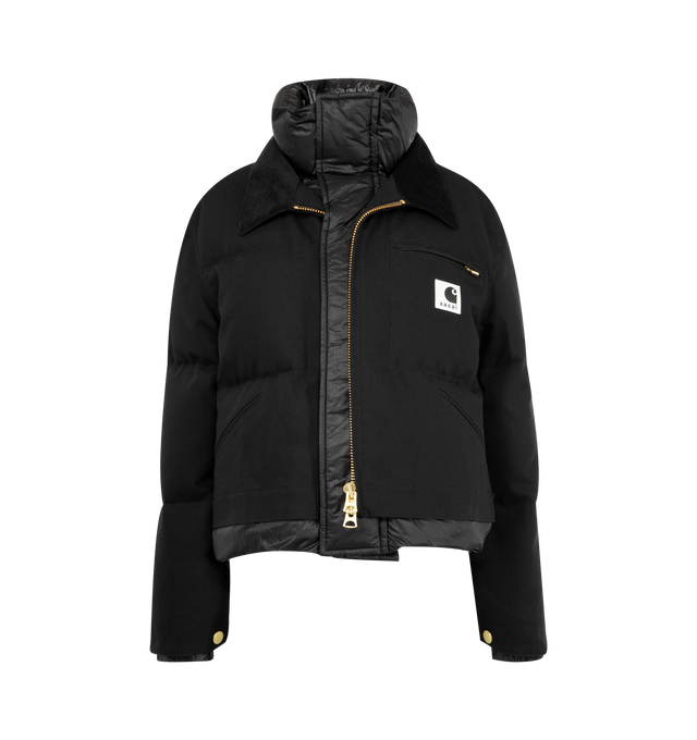 Image 1 of 3 - BLACK - Sacai x Carhartt WIP Duck Puffer Jacket in a boxy, cropped fit and layered silhouette combining a signature canvas exterior with a plush quilted nylon interior. Features stand collar and spread collar, long sleeves, elasticized snap cuffs, chest zip pocket, side patch pockets, concealed snap, two-way front zip closure, finished with a co-branded woven label. Cotton outer, 100% nylon and 100% cupro lining, 90% duck down/10% duck feather fill. Made in Japan.