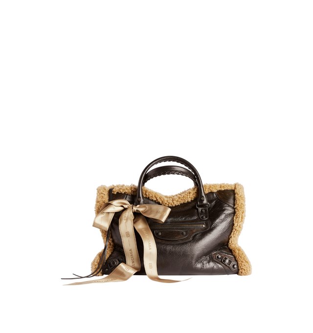 Image 1 of 4 - BROWN - BALENCIAGA Le City Bag Medium in brown calfskin and beige shearling, brass hardware featuring two leather hand-braided handles, adjustable and removable shoulder strap, ribbon with Balenciaga logo on the front, zipped closure with knotted leather puller, front zipped pocket with knotted leather puller, 1 inner zipped pocket and cotton canvas lining. 15.1" x 9.4" x 5.3". Calfskin, shearling, polyester. Made in Italy.