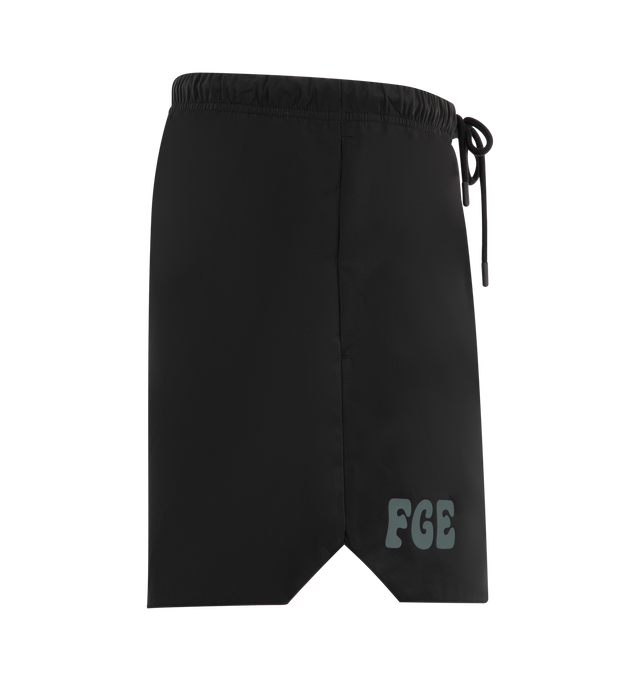 Image 3 of 3 - BLACK - Fear of God Essentials Mens Gym Shorts are crafted from polyester. Feature a relaxed mid-length fit, perforated stretch lining, elasticized waistband with bungee drawcord and toggle, side pockets, puff-printed FGE and F26 graphics, and an Essentials logo label. Main Material: 100% Polyester.