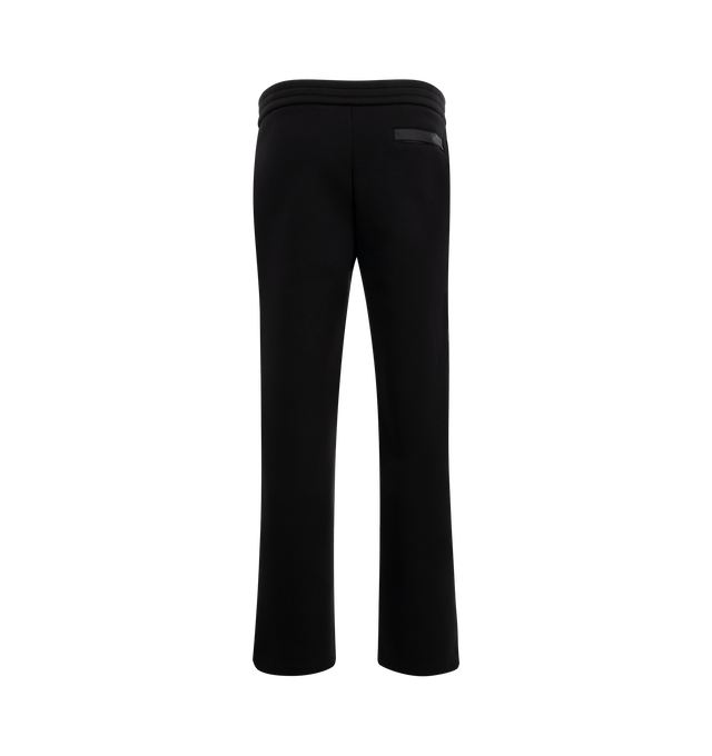 Image 2 of 3 - BLACK - Moncler Logo Cotton and Neoprene Sweatpants have an elastic drawstring waistband, front pleats, side pockets, a silicone logo patch, and a snap button back pocket. 55% cotton, 45% polyester. Made in Turkey.