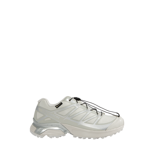 Image 1 of 5 - WHITE - Salomon XT-Pathway GTX Sneakers are a lace-up style with a quickLACE system, ACS stability, Mud Contagrip chevron rubber lug outsoles, anti-debris interior mesh, synthetic uppers, textile linings, lace pockets, protective toe caps, protective mudguards, OrthoLite die-cut sock liners, and GORE-TEX waterproofing. Unisex style in men's sizing.