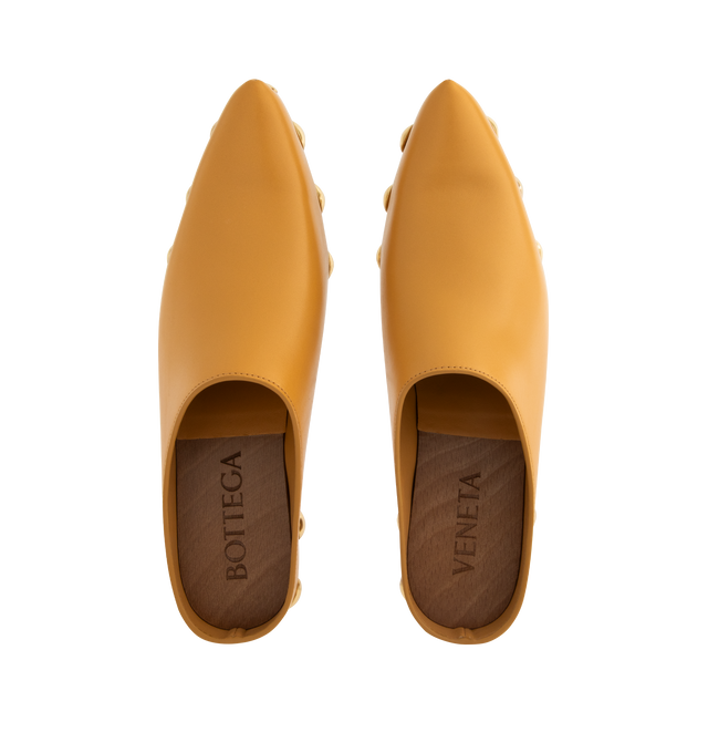 Image 4 of 4 - YELLOW - BOTTEGA VENETA Gondola Clog featuring shiny calf leather with metal stud detailing and beech wood platform. Lining: Calfskin. Lugged rubber outsole. Made in Italy.
