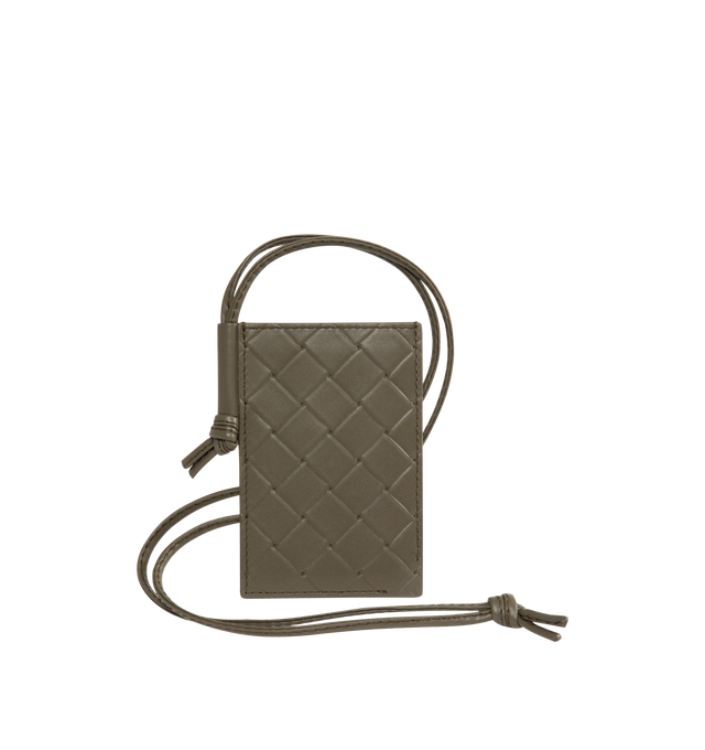 Image 1 of 2 - GREEN - BOTTEGA VENETA Intrecciato Stamp Badge Holder featuring calf leather with embossed Intrecciato pattern, single card slot and leather strap. 4.1" x 2.8" x 0.2". Strap drop: 17.7". Calfskin. Made in Italy.