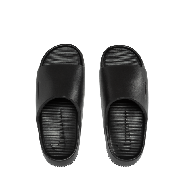Image 5 of 5 - BLACK - NIKE Calm minimalist slides with debossed Nike Swoosh logo. Contoured foam composition is super soft with a responsive feel. The textured footed is for the stay-put foot placement. This shoe has a full-length rubber outsole for guaranteed grip on all surfaces with quick-drying design. 