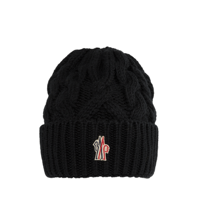 Image 1 of 2 - BLACK - MONCLER GRENOBLE CABLE KNIT WOOL BEANIE featuring ultra-fine wool, stockinette stitch, Gauge 3 and nylon laqu tricolor logo. 100% virgin wool. 