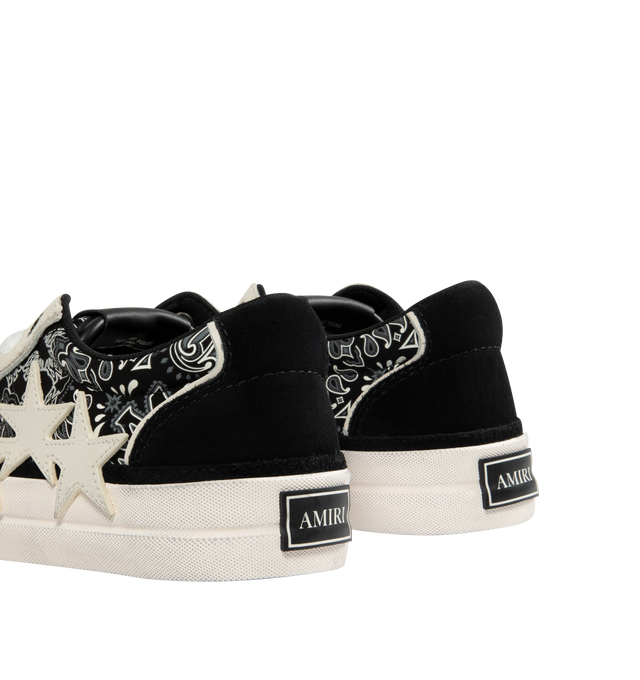 Image 3 of 5 - BLACK - AMIRI Sunset Skate Low-Top Sneakers featuring low-top sneakers in leather with bandana paneling, flat heel, round toe, lace-up vamp, wide shoelaces, logo on the tongue, leather lining, padded collar, heel logo, lather star appliqus on the sides and rubber outsole.