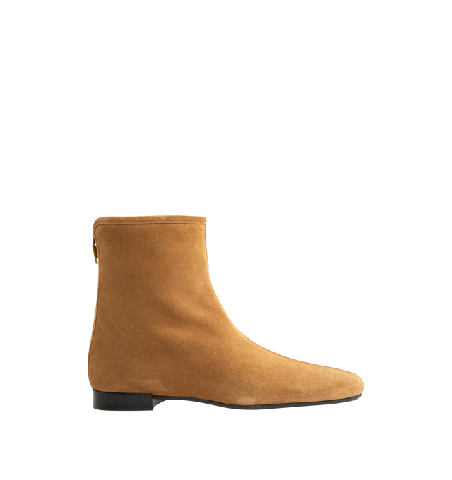 Image 1 of 4 - NEUTRAL - Toteme Women's Shearling-Lined Suede Ankle Boots are crafted from lamb suede and feature a streamlined ankle boot silhouette with a modern square toe and fold-over uppers. Designed for cold-weather wear, this refined style is enhanced by a plush shearling lining and trim, combining warmth with Toteme's signature minimalist aesthetic. Main Material: Lamb Leather Suede. Lining: Shearling. Trim: Shearling. Insole: Leather. Sole: Rubber. Includes: Shoe Box, Dust Bag. Made in Italy.
