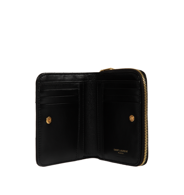 Image 2 of 2 - BLACK - SAINT LAURENT Compact Zip Around Wallet featuring gold tone hardware, six card slots, one zipped coin pocket, one bill compartment and four receipt compartments. 4.7 X 3.9 X 1.1 inches. 85% lambskin, 15% brass. Made in Italy.  