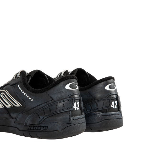 Image 3 of 5 - BLACK - BALENCIAGA Hamptons Worn-Out Sneaker in cowskin and polyester featuring worn-out effect, scribbled laces, raw edge and visible stitching on the upper, Balenciaga logo debossed on the upper, Balenciaga logo embossed on the outsole, 3B sports icon artwork in rubber on each side, loop sports icon logo on the tongue and at back heel and written size debossed on the upper and at back of the heel. Upper: cowskin, polyester. Sole: rubber. Insole: foam. Made in China.