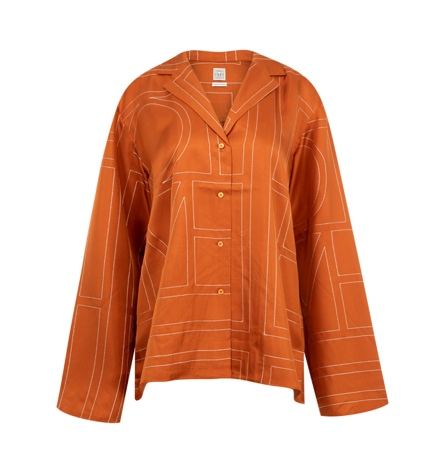 Image 1 of 2 - ORANGE - TOTEME Monogram Silk Pajama-Style Top featuring fine monogram pattern, notch collar, long wide sleeves, and mother-of-pearl button closure. 100% silk.