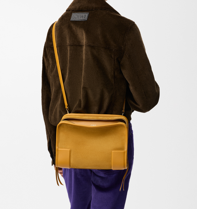 Image 4 of 16 - YELLOW - Loewe Women's Amazona 180 Medium Bag is crafted from suede and calf leather and features a relaxed silhouette with a single toron top handle, a concealed magnetic closure, and removable shoulder and crossbody straps. Designed with two compartments, an internal flat pocket, and a side D-ring for personalization, this versatile style can be carried by hand, over the shoulder, or crossbody. Suede lining and embossed LOEWE branding complete the design. Main Material: Suede/Calf Leather.