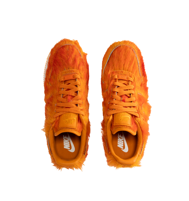 Image 5 of 5 - ORANGE - Nike Air Force 1 "Multi-Color and Sunset" Sneakers update the classic basketball-inspired silhouette with a shaggy, hair-like upper in vivid sunset orange. Tonal Swoosh branding, a lace-up closure, and a padded collar complete the low-top design, while a white Air-cushioned midsole and orange rubber outsole provide comfort and traction. Sole: Rubber.