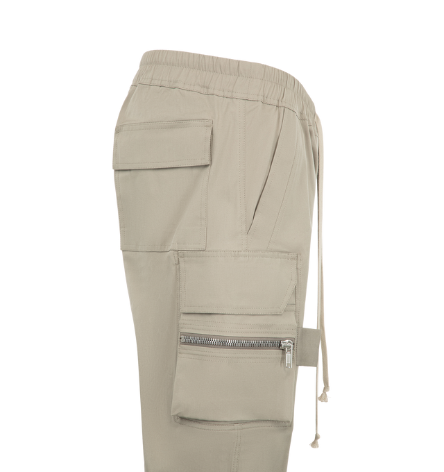 Image 3 of 3 - GREY - Rick Owens Men's Mastodon Cargo Pants are crafted from lightweight feather material and feature a slim-fit, full-length silhouette with an elasticized drawstring waistband. Designed with side pockets, zippered cargo pockets at the thighs, back flap pockets, and elasticized ankles, the style combines utilitarian detailing with a streamlined profile.