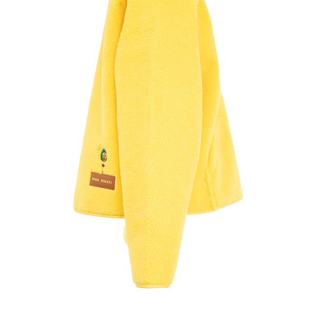 Image 3 of 3 - YELLOW - Mira Mikati Women's Lowly Embroidered Zip-Front Fleece is crafted from plush shearling-effect polyester and features a slightly oversized silhouette inspired by the playful collaboration with Richard Scarry's beloved character, Lowly Worm. Fully lined in soft polar fleece for added warmth and comfort, this cozy layer is detailed with embroidered artwork, a front zip closure, and a split kangaroo pocket. Main Material: 100% Polyester.